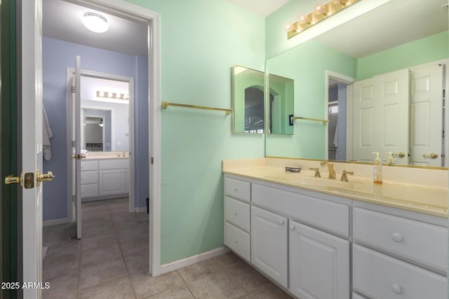 bathroom with vanity and tile patterned flooring