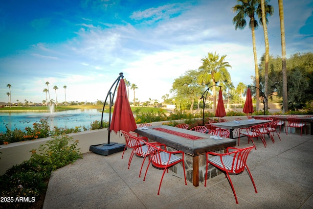 view of patio with a water view