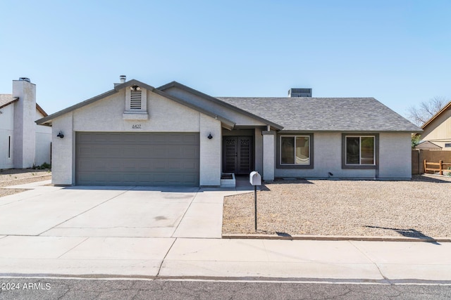 single story home featuring a garage