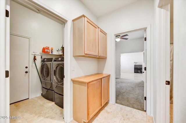 clothes washing area featuring laundry area, a ceiling fan, light colored carpet, washer and dryer, and light tile patterned flooring