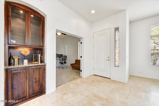 entryway featuring recessed lighting and light colored carpet