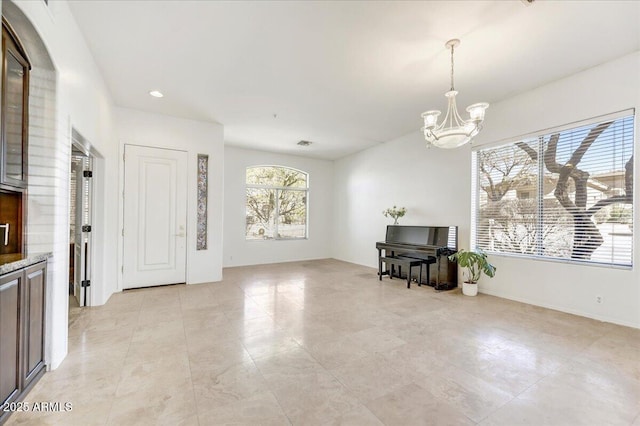 interior space with an inviting chandelier, visible vents, and recessed lighting