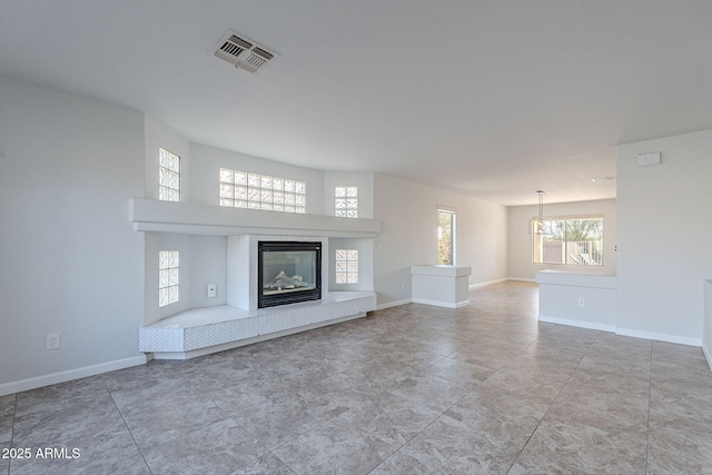 unfurnished living room with a wealth of natural light