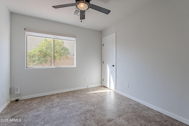 tiled empty room with ceiling fan