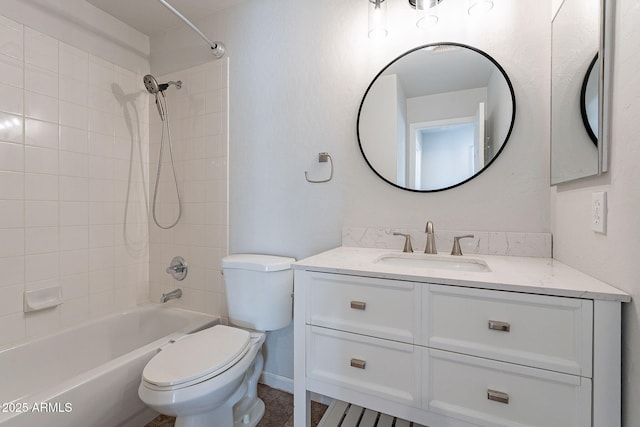 full bathroom with toilet, vanity, and tiled shower / bath