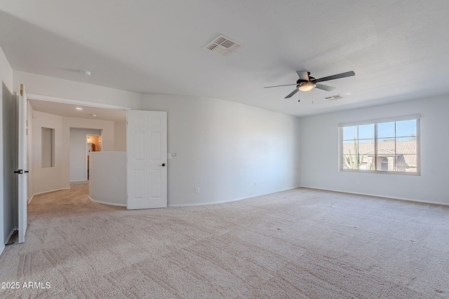 carpeted empty room with ceiling fan