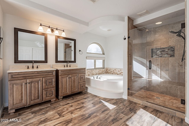 bathroom with separate shower and tub and vanity