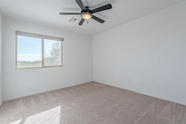 empty room featuring carpet and ceiling fan