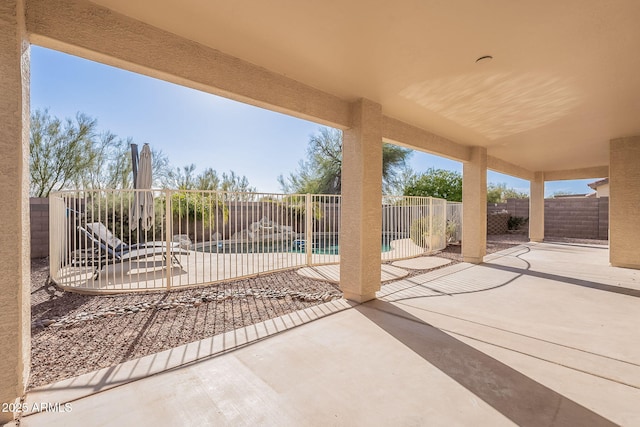 view of patio / terrace featuring a fenced in pool