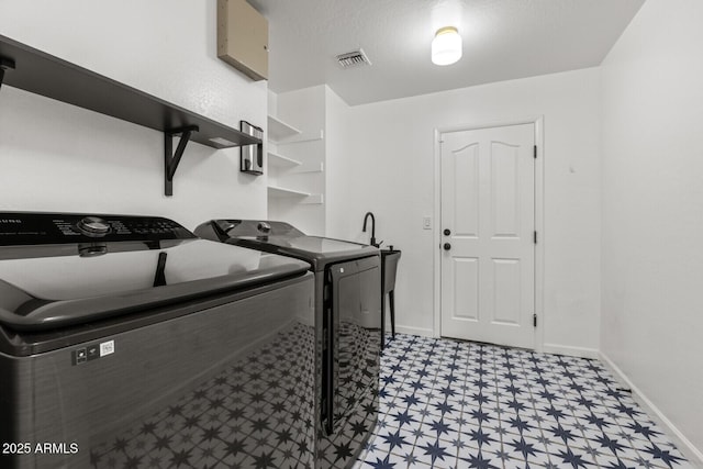 laundry room featuring washing machine and dryer