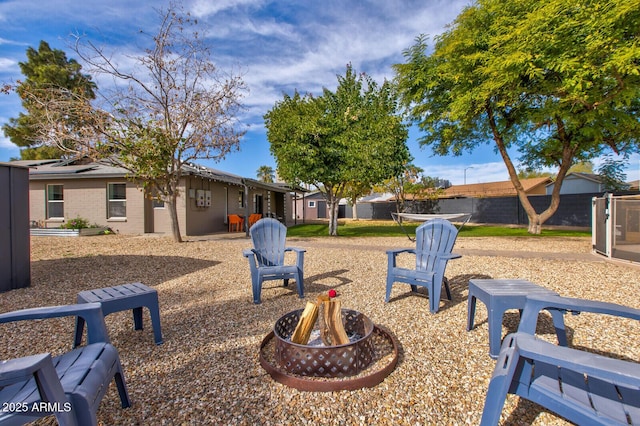 view of yard featuring a fire pit