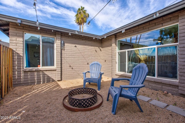 view of patio with an outdoor fire pit