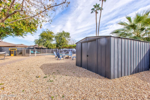 view of outbuilding featuring a fenced in pool