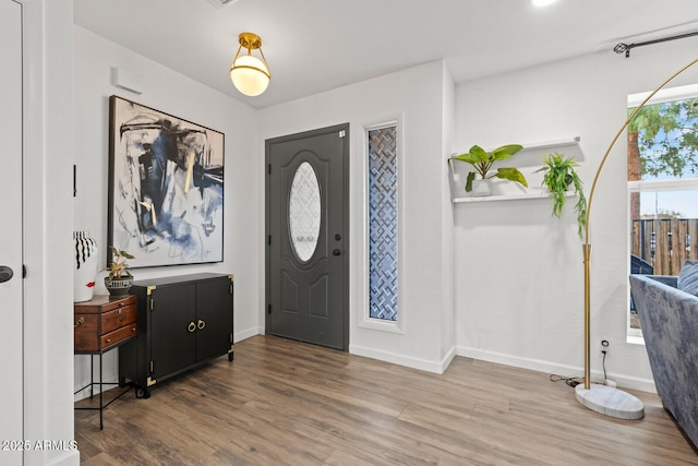 foyer entrance with hardwood / wood-style floors