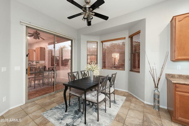 dining space featuring baseboards