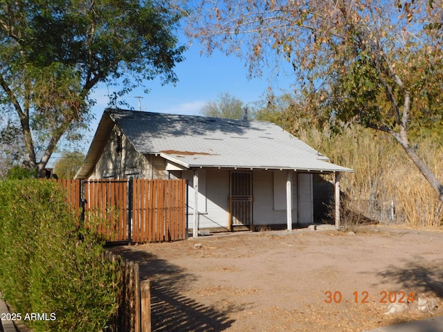 2206 N 11th St, Phoenix, AZ 85006 - view of front of house with fence, roof with shingles, and covered porch