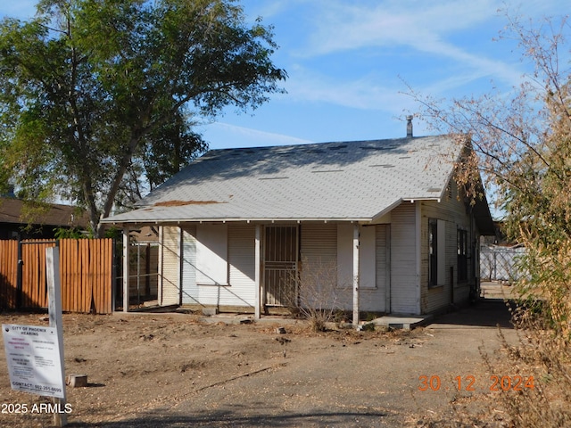 2206 N 11th St, Phoenix, AZ 85006 - view of front facade with fence, covered porch, and roof with shingles