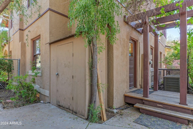 entrance to property with a pergola