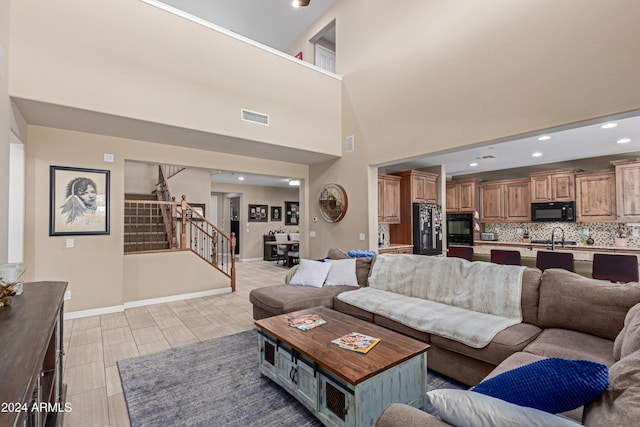 living room with a towering ceiling