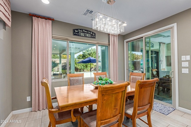 dining room featuring a notable chandelier