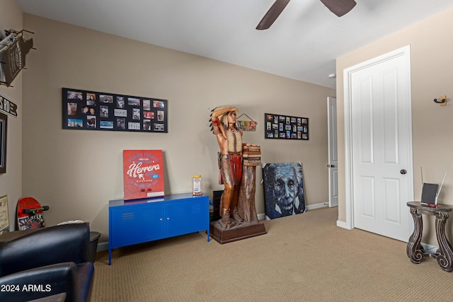 game room with carpet and ceiling fan