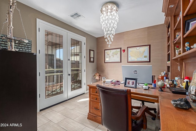 office with french doors and a notable chandelier