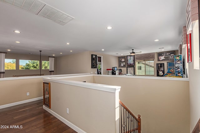 hallway with hardwood / wood-style flooring