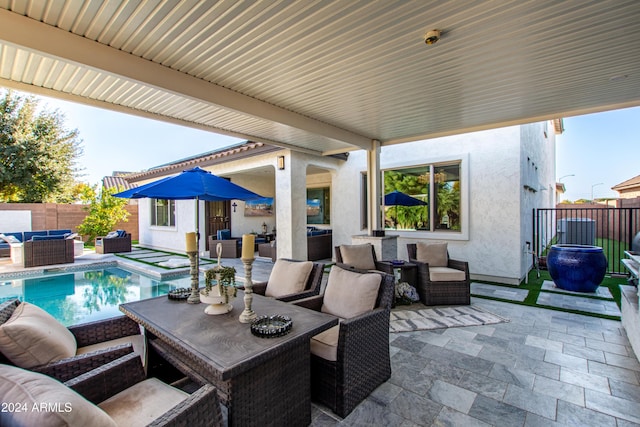 view of patio featuring a fenced in pool and outdoor lounge area