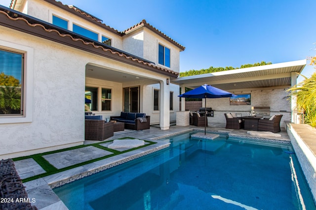 view of pool featuring an outdoor living space, area for grilling, and a patio area