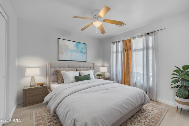 23693 W Grove St, Buckeye, AZ 85326 - bedroom with baseboards, light wood-type flooring, and a ceiling fan