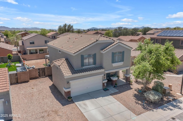 23693 W Grove St, Buckeye, AZ 85326 - mediterranean / spanish home featuring stucco siding, a residential view, a gate, and a tiled roof