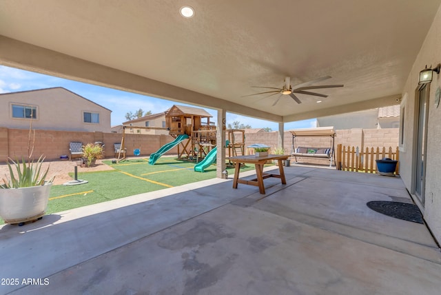 23693 W Grove St, Buckeye, AZ 85326 - view of patio / terrace with a ceiling fan and a playground