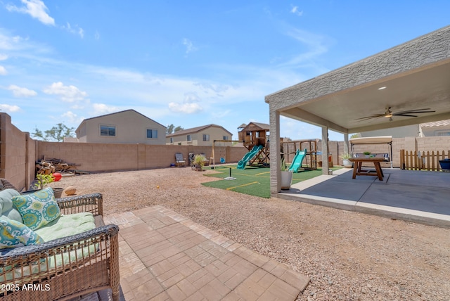 23693 W Grove St, Buckeye, AZ 85326 - view of patio with a playground, a fenced backyard, and ceiling fan