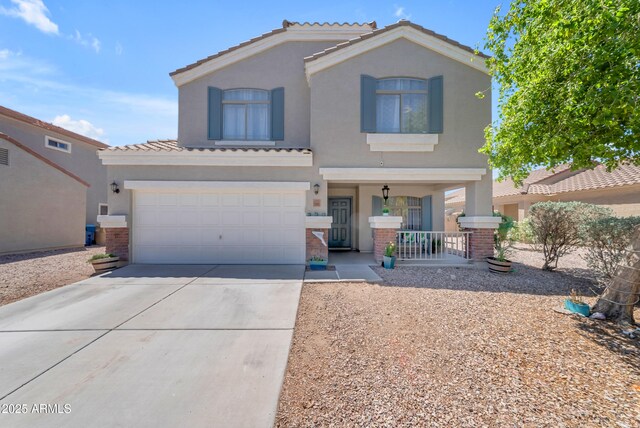 23693 W Grove St, Buckeye, AZ 85326 - view of front of home featuring a porch, concrete driveway, stucco siding, a garage, and a tile roof