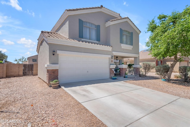 23693 W Grove St, Buckeye, AZ 85326 - mediterranean / spanish-style house featuring concrete driveway, fence, a gate, stucco siding, and brick siding