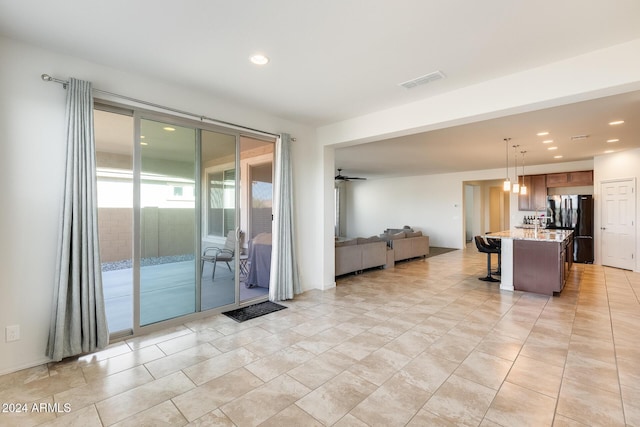 interior space featuring ceiling fan