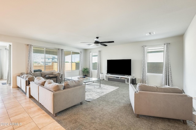 living room featuring ceiling fan and light tile patterned flooring