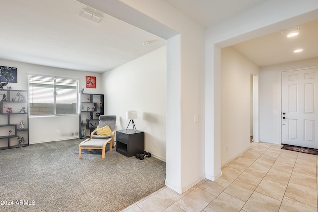 living area featuring light colored carpet