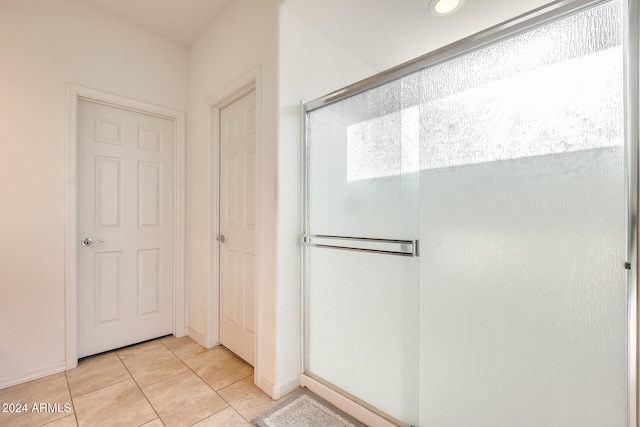 bathroom featuring tile patterned flooring and walk in shower