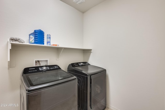 laundry room with washer and dryer