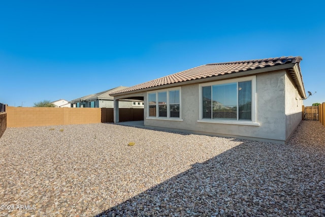 rear view of house featuring a patio area