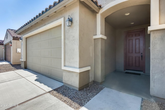 property entrance featuring a garage