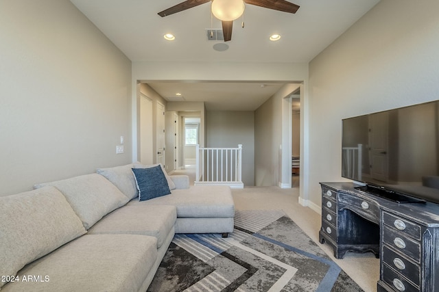 living room with ceiling fan and light colored carpet