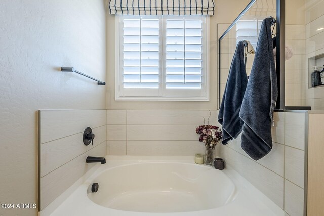 bathroom featuring a bath