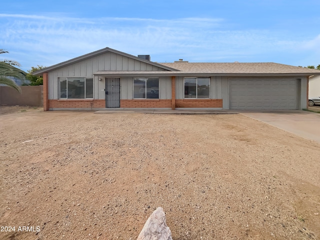 single story home with a garage