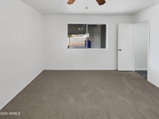 spare room with carpet flooring and ceiling fan