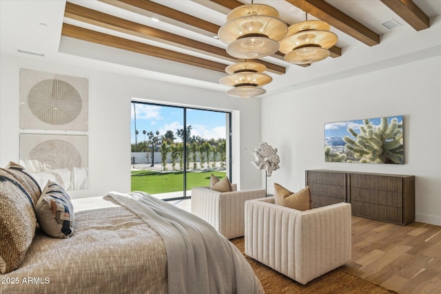 bedroom with wood-type flooring, access to exterior, and an inviting chandelier