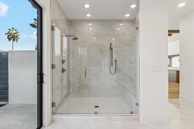 bathroom with a shower with shower door