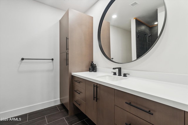 bathroom with a shower and vanity