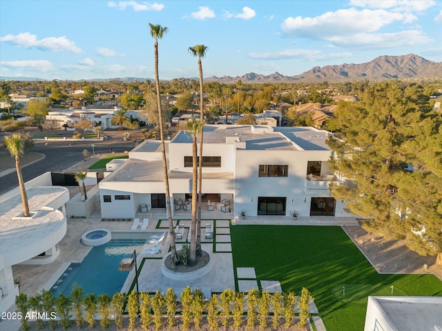 birds eye view of property featuring a mountain view